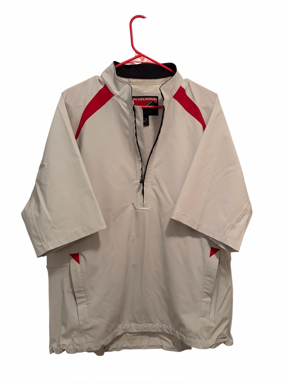 Sun Mountain golf rain pullover (beige/tan with red trim accents). Size medium